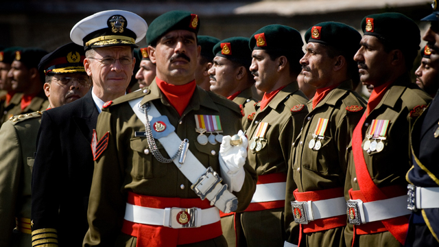American Chairman of Joint Chiefs Admiral Mike Mullen reviews Pakistani troops during a ceremony honoring Mullen's arrival in Islamabad in 2008